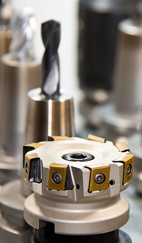 Close-up of a precision milling cutter tool, essential for machining operations in industrial manufacturing.